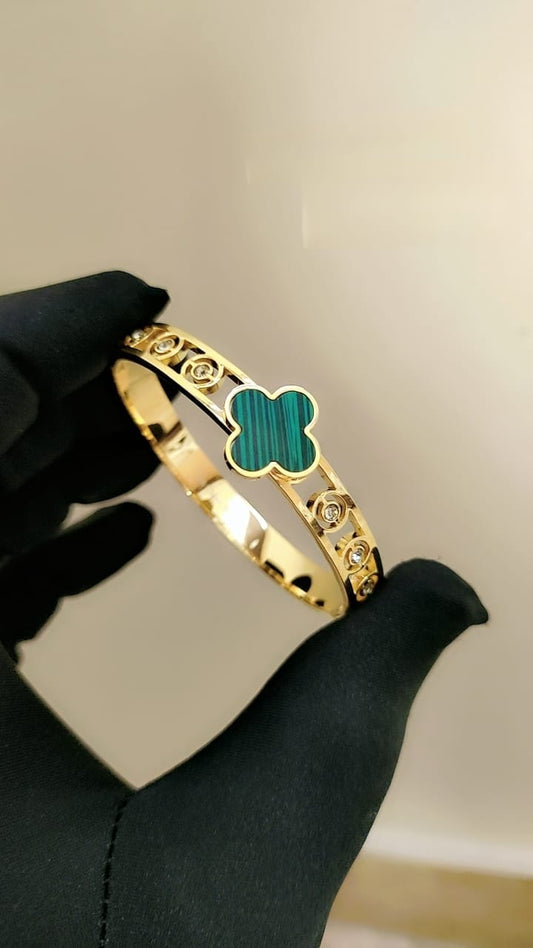 Luxury Gold Bangle with Embedded Gemstones